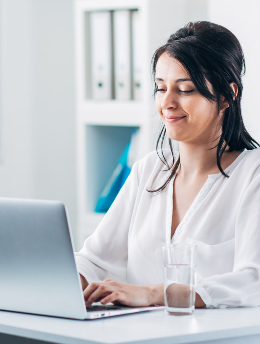 Person smiling looking at computer