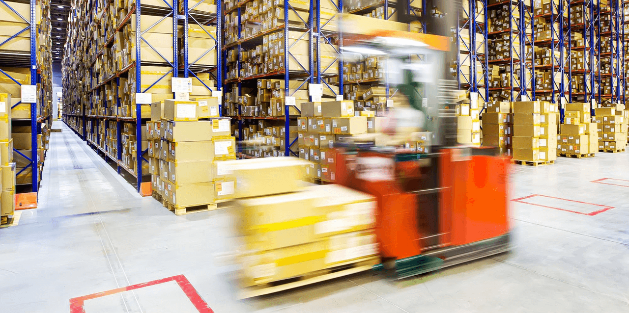 supply cart moving boxes in warehouse